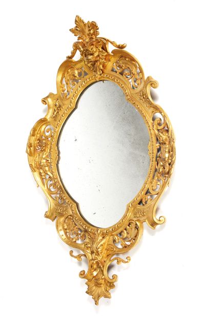 MIROIR Mirror

Oval shape in chased and gilded bronze, the four-lobed mirror inscribed...