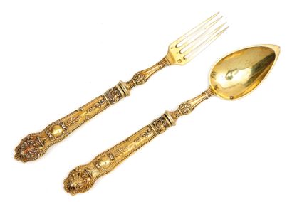 COUVERT Cutlery 

in gilt, the handle with decoration in relief of foliage and characters...