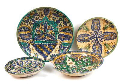 Four earthenware dishes with blue, green...