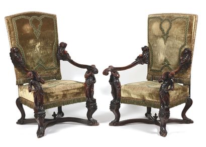 null Pair of armchairs
with upholstered backs in molded walnut, carved with loves...
