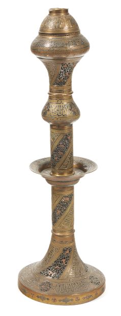 null Chased brass mosque lamp element decorated with partially openwork votive inscriptions.
Syrian...