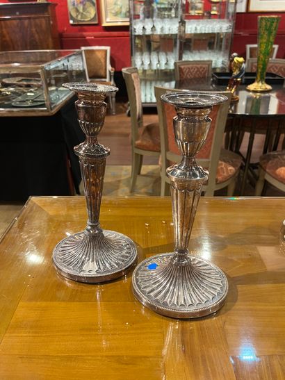 null Pair of silver-plated torches with fluted shafts and oval bases with radiating...