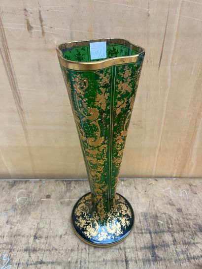 null Green enameled glass long-necked vase with gilded rocailles.
Early 20th century.
Height:...