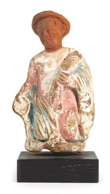 null Statuette depicting a half-naked ithyphallic figure, holding his penis in one...