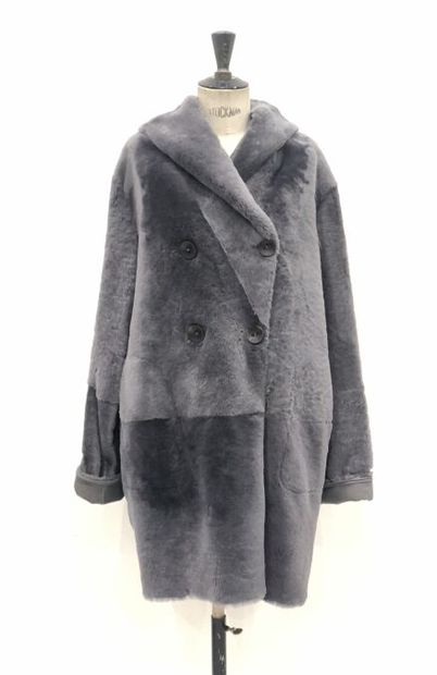 null Manteau gris réversible avec d'un côté une peau souple en agneau et de l'autre...