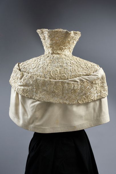 null Worth scratched collar (no. 12935), circa 1900, beige woollen cloth overstitched...