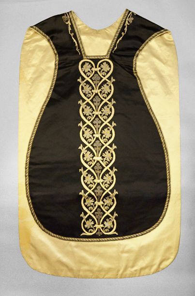 null Chasuble, early 20th century, black silk satin embroidered in gold thread and...