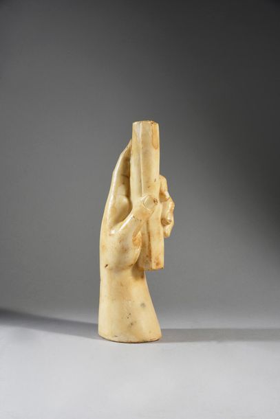 Hand holding a scroll, white patinated marble....