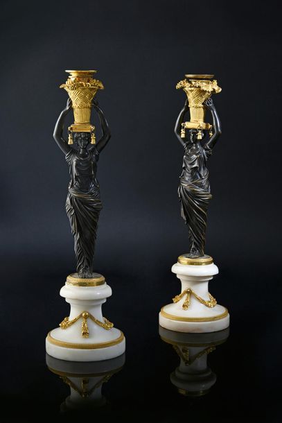 Pair of candleholders in chased and gilt...