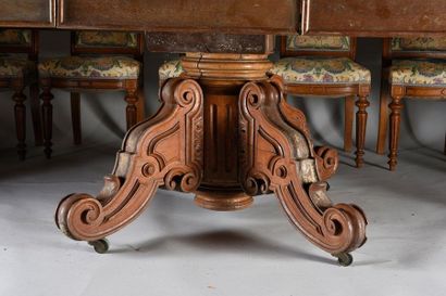 null Oval dining table in Hungarian oak, it rests on a large central leg on castors...