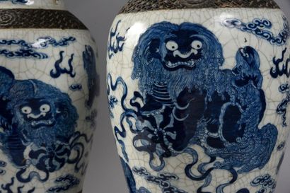 Nankin. 
An important pair of cracked stoneware vases in baluster shape with Buddhist...