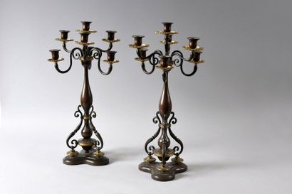 Pair of candelabra in patinated and gilded...