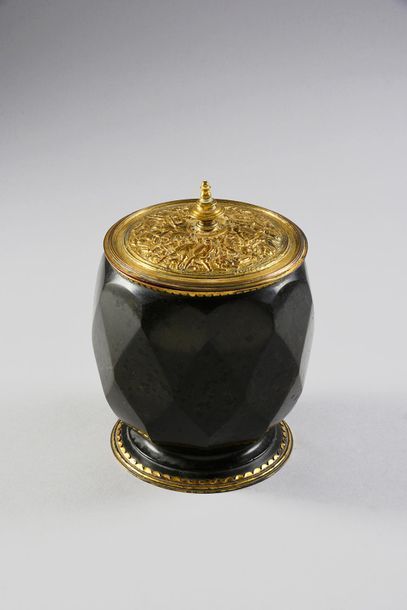 null Serpentine tobacco jar, the gilt copper frame resting on a round base with a...