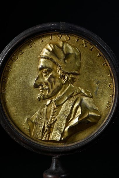 null Bronze plate in chased and gilded bronze, representing the profile of Pope Innocent...