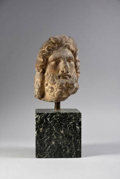 null Head from a statue probably representing the god Zeus or Jupiter. He wears a...