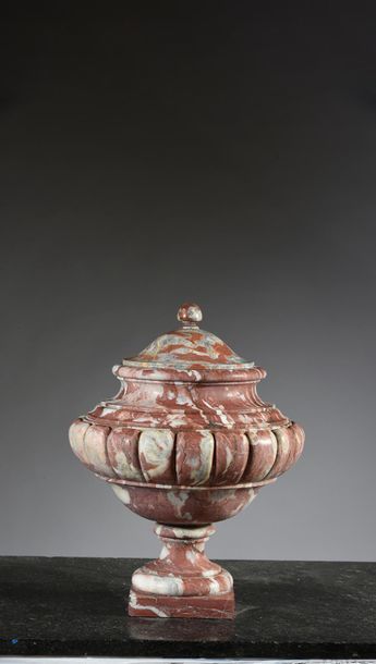  Covered vase in red Languedoc marble, baluster-shaped, the body decorated with large...