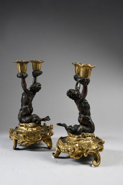null Pair of two-light candelabra in chased patinated and gilded bronze, made of...