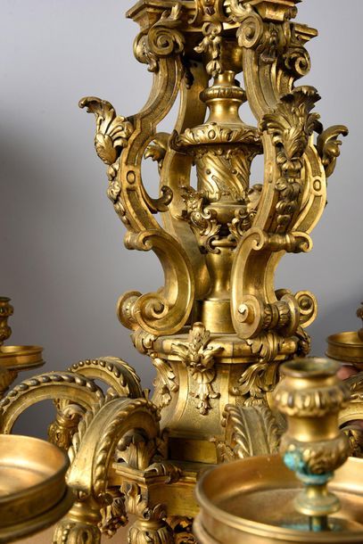  Chiseled and gilt bronze chandelier with eight light arms leaved with acanthus leaves....