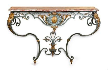  Console in lacquered and gilded wrought iron. The S-shaped feet decorated with shells,...