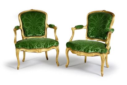  Pair of cabriolets in carved and gilded wood, with a violin back and arched legs....
