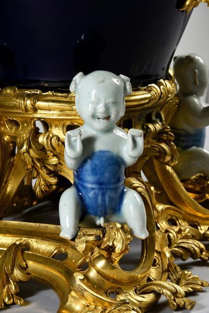 null FONTAINE A PARFUM
In chased and partly gilded bronze, blue porcelain and enamelled...