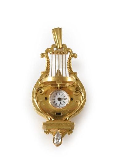 null Pendant watch in 750th gold, featuring a lyre, it is decorated with a miniature...