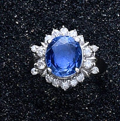 null Platinum ring set with a 5.82 carat oval sapphire in a diamond setting.
The...