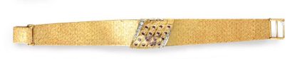 EBEL. 
Bandeau wristwatch in 750e gold, the dial concealed by a flap set with small...