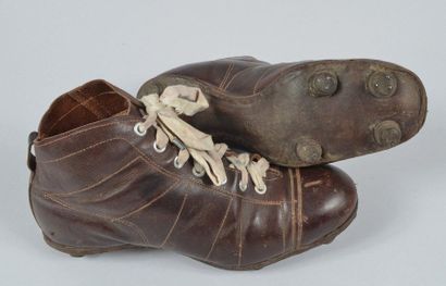 null Pair of brown leather shoes with 6 leather studs from Boudur mark. Mid high...