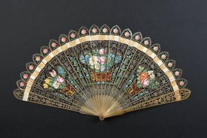 null Baskets of flowers, circa 1820
A very finely pierced horn fan of the broken...