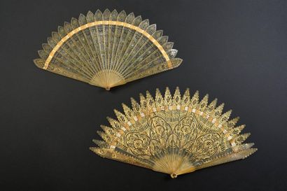 null Two fans, circa 1830
, of the broken type in blond horn, one with gold decoration,...