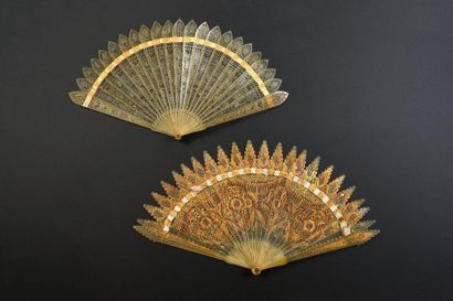 null Two fans, circa 1830
, of the broken type in blond horn, one with gold decoration,...