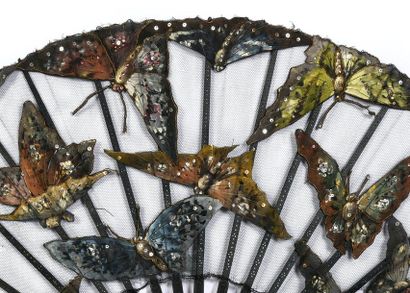 null Moths, circa 1890
Large folded fan, the black tulle leaf decorated with large...