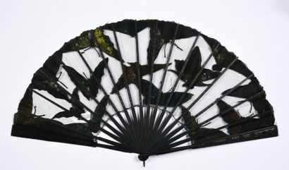 null Moths, circa 1890
Large folded fan, the black tulle leaf decorated with large...