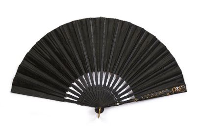 null Elegant evening, circa 1900
Fan, the black silk leaf painted with an interior...