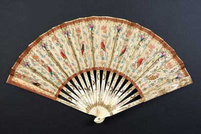 null The parrots, circa 1900-1920
Folded fan, silk leaf painted with parrots in colourful...
