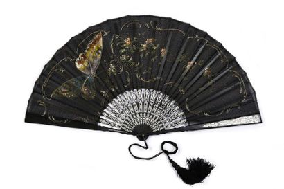null Scintillating butterfly, circa 1900
Folded fan, the black gauze leaf painted...