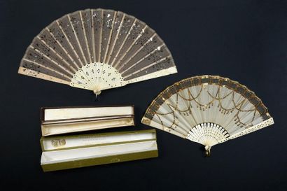 null Sequins, circa 1930
Two fans, the leaves decorated with sequins.
Bone frames.
One...