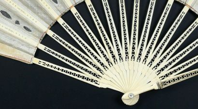 null 18th century spirit, circa 1900
Large folded fan, the silk leaf adorned with...