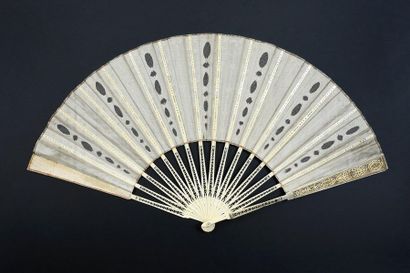 null 18th century spirit, circa 1900
Large folded fan, the silk leaf adorned with...