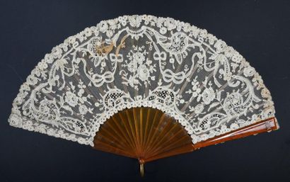 null Ribbons and flowers, circa 1900
Fan, the lace leaf decorated with flowers, including...