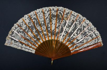 null Ribbons and flowers, circa 1900
Fan, the lace leaf decorated with flowers, including...