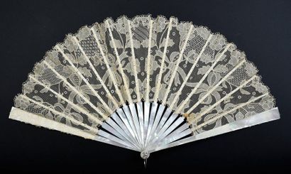 null Lace ribbons, circa 1900
Folded fan, the lace leaf, Carrickmacross type, with...