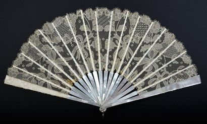 null Lace ribbons, circa 1900
Folded fan, the lace leaf, Carrickmacross type, with...