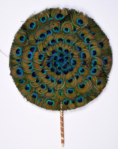 null Hand-held screen, India, mid 20th century
Composed of peacock ocelli in radiant...