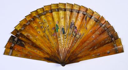 null Sous l'ombrelle, vers 1810-1820
Éventail de type brisé en corne, à effet écaille,...