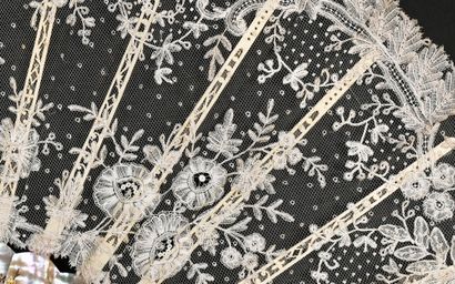 null Flowering groves, circa 1890
Folded fan, the leaf in bobbin lace drawing under...