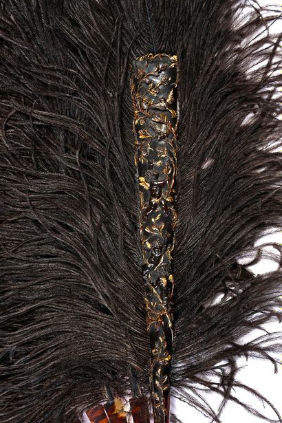 null Carved loves, circa 1890- 1900
Black ostrich feather fan.
Brown tortoiseshell...