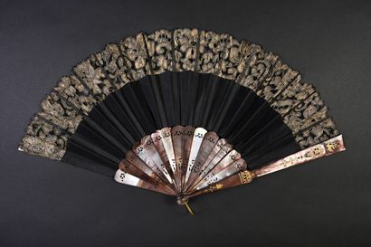 null Flowers in gold thread, circa 1890
Folded fan, the black satin sheet painted...