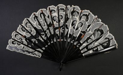 null Pansies, circa 1900-1920
Folded fan, the black tulle leaf embroidered with a...